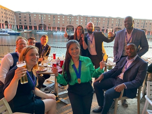A group of people raising glasses in celebration